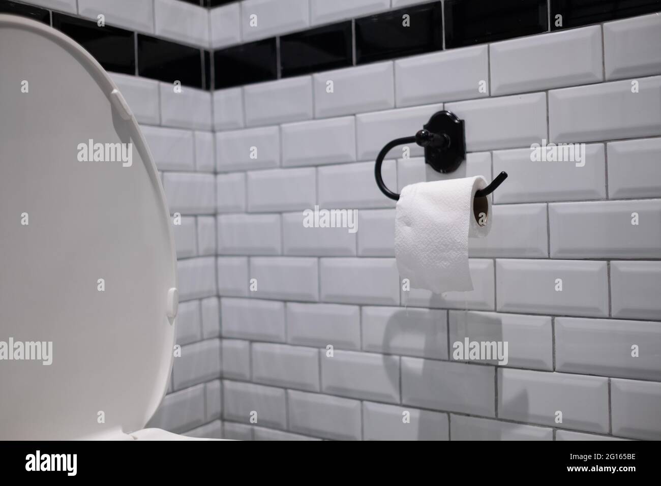 tissue paper on wall, toilet Stock Photo Alamy