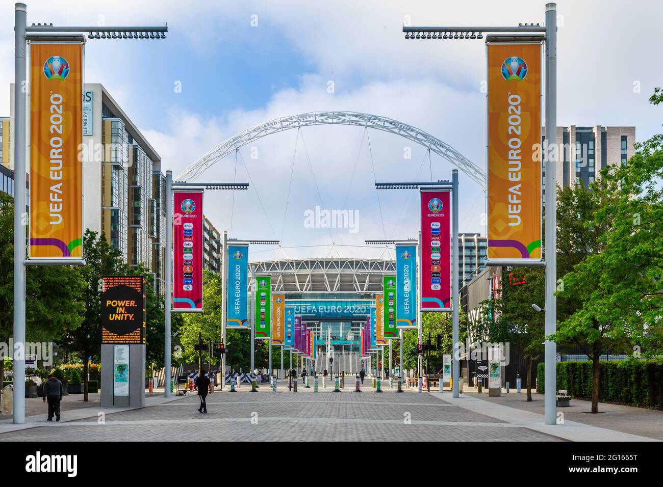 Wembley Stadium, Wembley Park, UK. 5th June 2021. Wembley continues its preparations for the UEFA European Football Championship with the flagpoles along Olympic Way changed to brightly coloured Euro 2020 banners.  The tournament starts in 6 days, 11th June 2021. It was postponed by a year as the Coronavirus pandemic hit worldwide in 2020.  Amanda Rose/Alamy Live News Stock Photo
