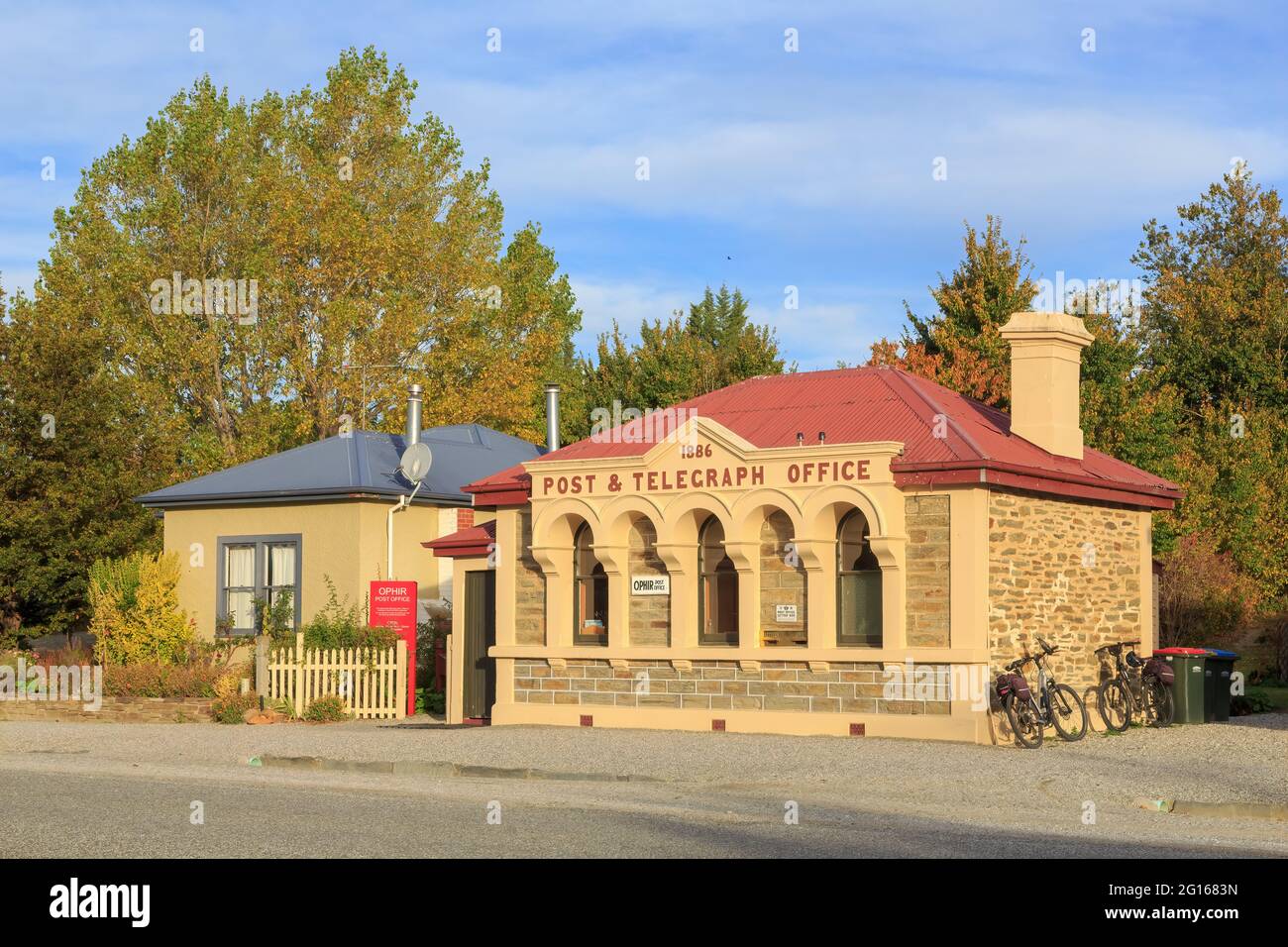 Ophir, a tiny town in the South Island of New Zealand. The historic Post & Telegraph Office (1886) next to the post office house Stock Photo