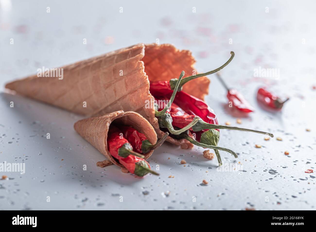 Spicy ice cream. Chilli peppers in ice cream cone. Unique ice cream