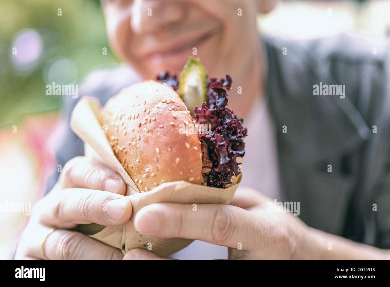 Appetizing to eat a sandwich with lettuce at lunch Stock Photo