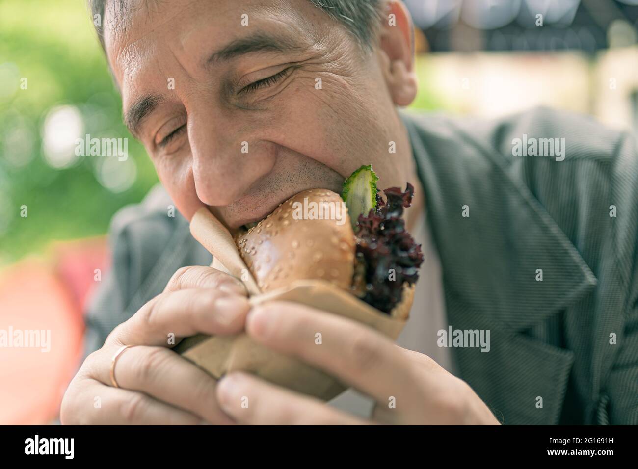 Appetizing to eat a sandwich with lettuce at lunch Stock Photo