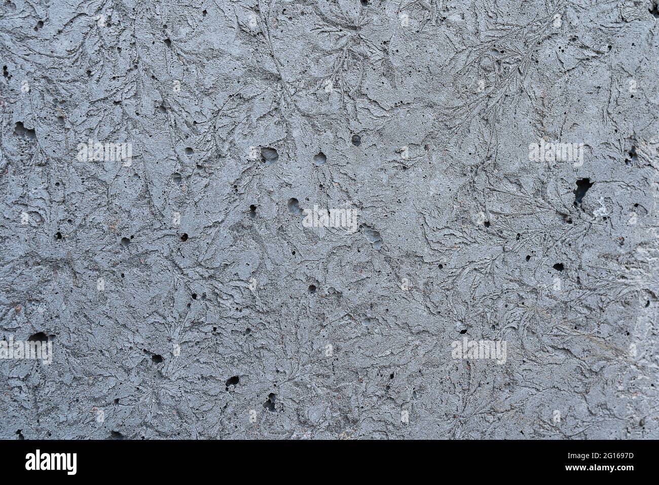 gray concrete wall with abstract cracks Stock Photo