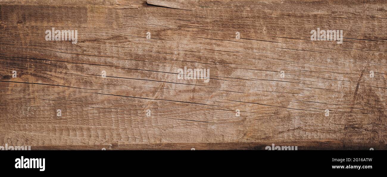Wood texture background. Brown rustic vintage backdrop. Old plank with cracks Stock Photo