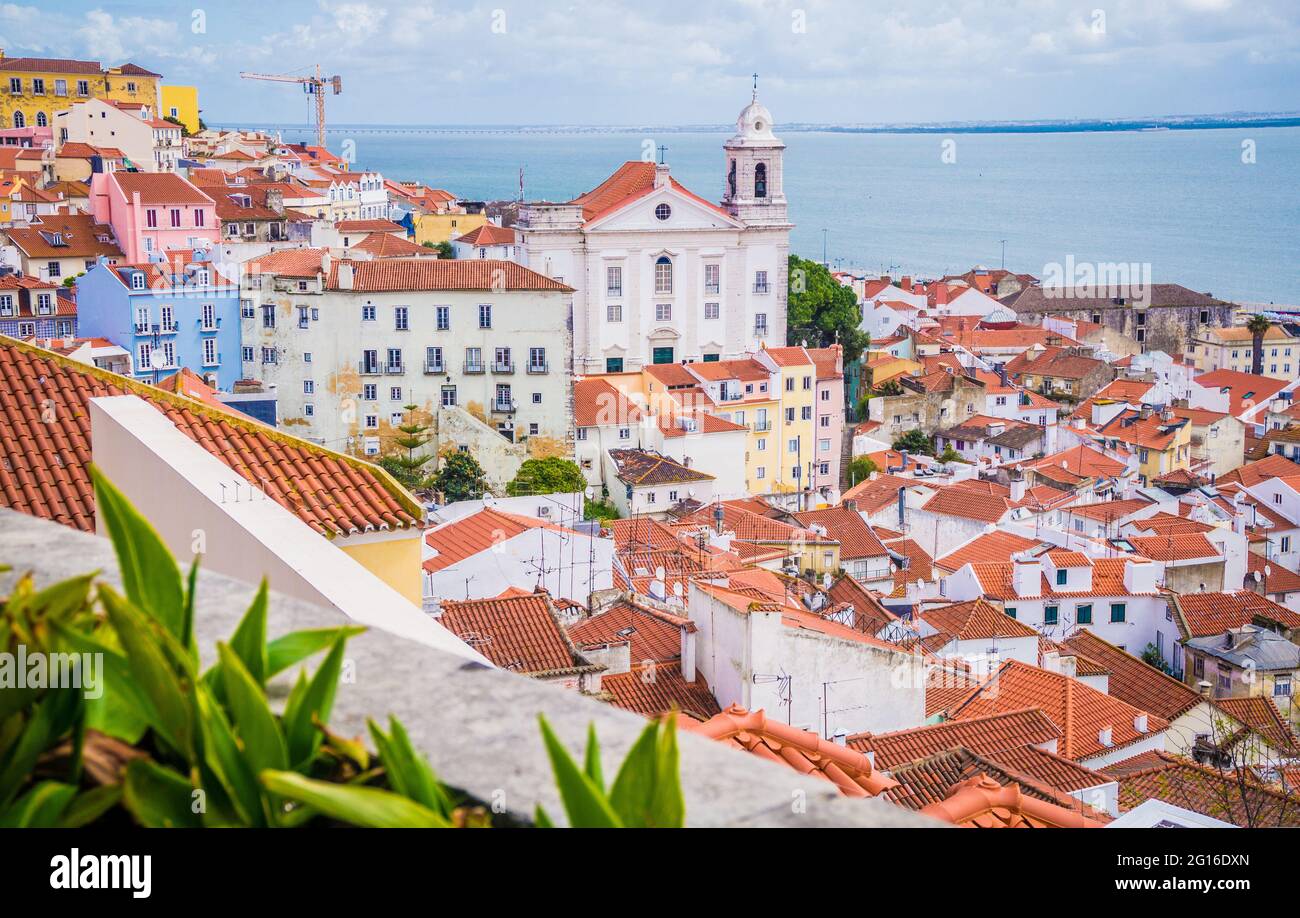 Panoramic aerial view old traditional city of Lisbon with red roofs, Saint Vicente de Fora Monastery view, Alfama district. Portugal Stock Photo
