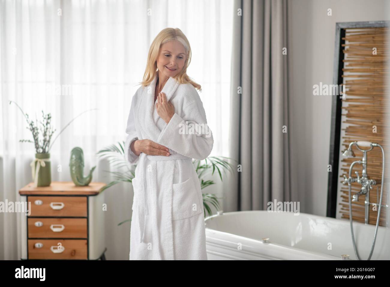 Contented woman in white hi-res stock photography and images - Alamy