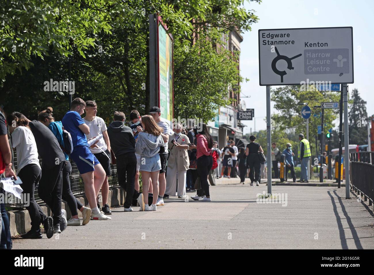 People queuing to go into Belmont Health Centre in Harrow which is offering a first dose of Pfizer coronavirus vaccine to anyone aged over 18 on Saturday and Sunday who is living or working in Harrow. Picture date: Saturday June 5, 2021. Stock Photo
