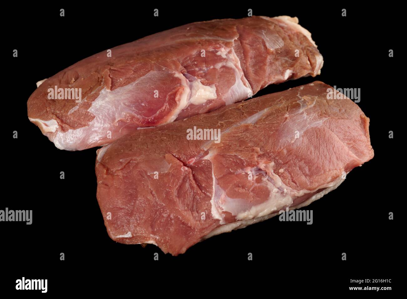 Two duck fillets isolated on black background Stock Photo