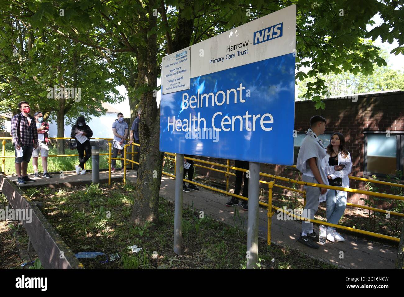People queuing to go into Belmont Health Centre in Harrow which is offering a first dose of Pfizer coronavirus vaccine to anyone aged over 18 on Saturday and Sunday who is living or working in Harrow. Picture date: Saturday June 5, 2021. Stock Photo
