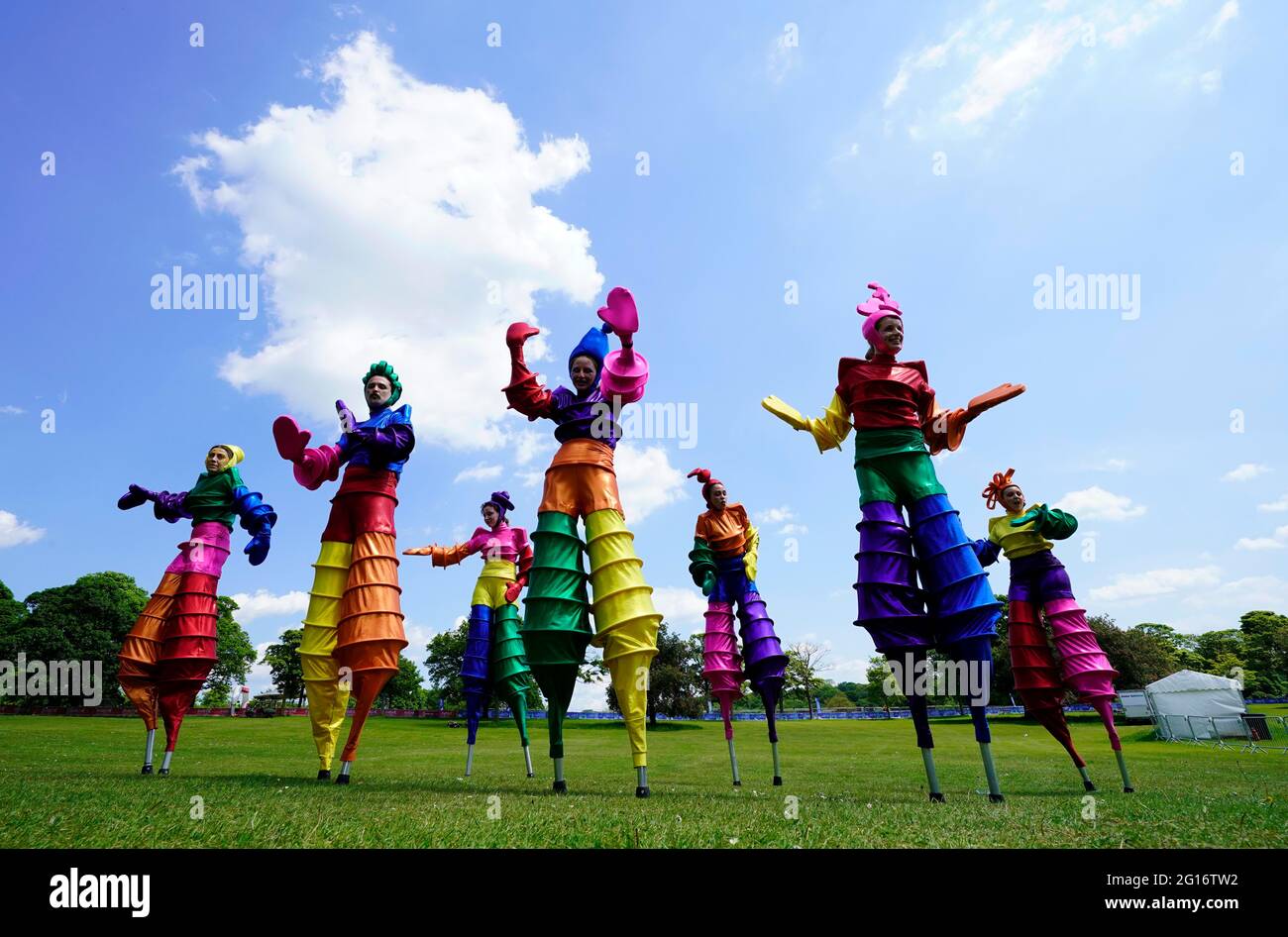 Members of Rainbow Carnival Stilt Walkers performing in Roundhay park
