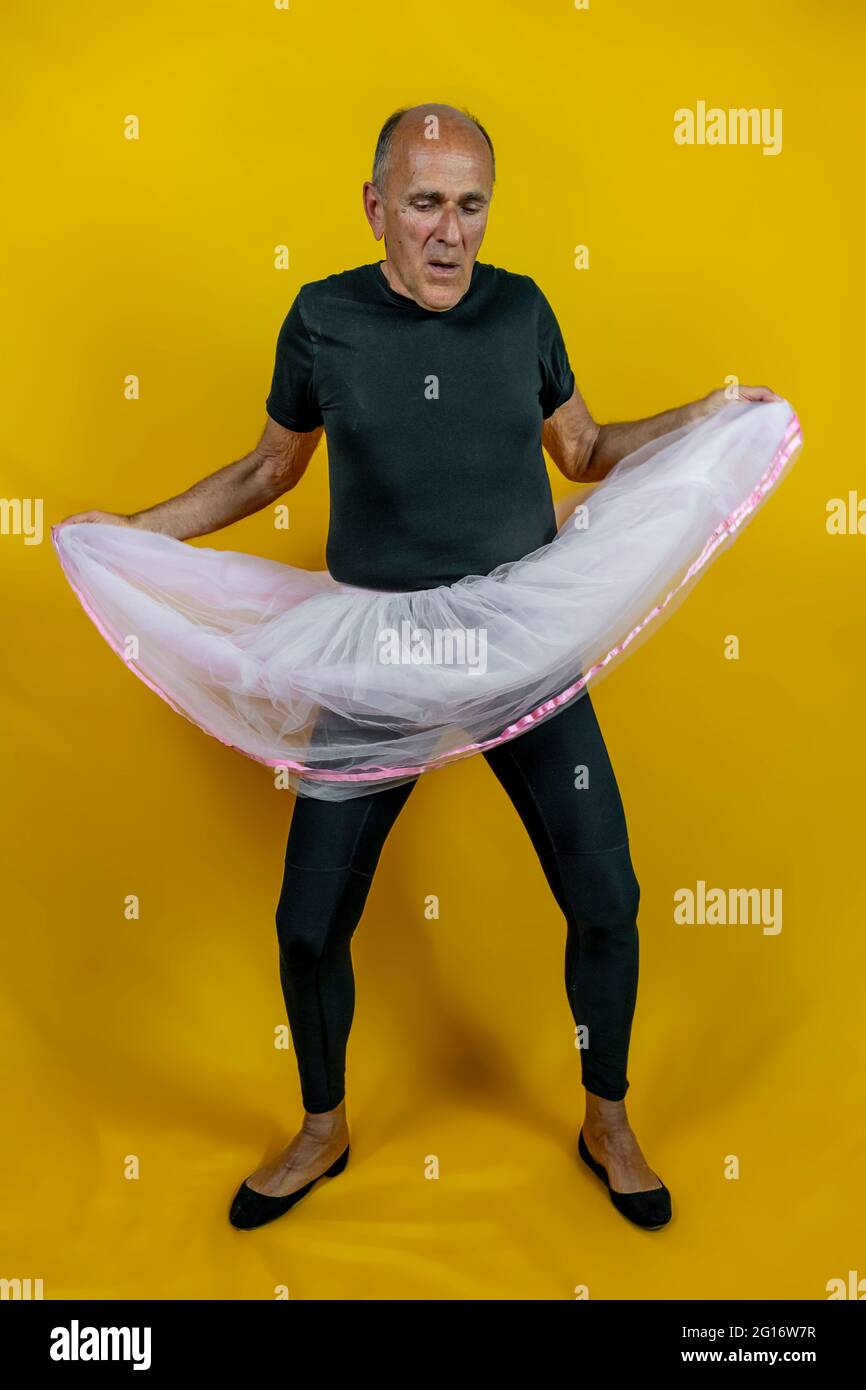 funny portrait of male ballet dancer. A mature ballet dancer dressed in  tutu dancing clumsily on colorful background Stock Photo - Alamy