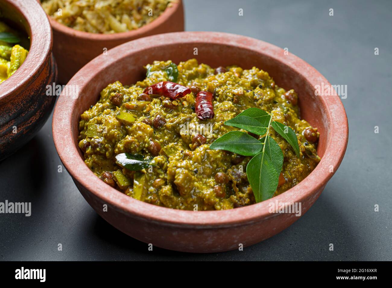 Kootu Curry - A traditional side dish prepared during festivals in Kerala, vegeterian dish made using  bengal gram, yam ,raw banana and coconut,arrang Stock Photo