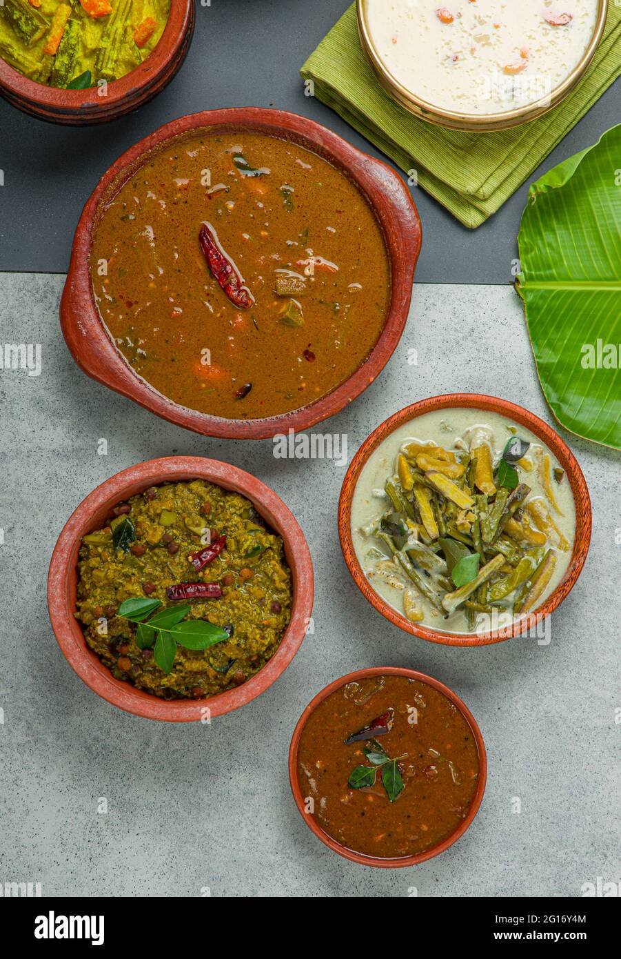 Kerala traditional feast side dishes arranged  in a two colour background Stock Photo