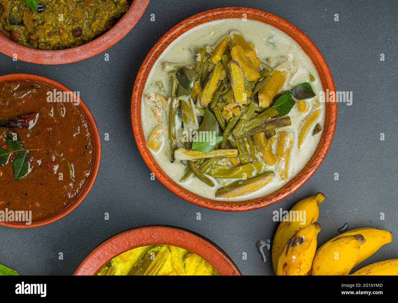 Kerala traditional feast side dishes arranged  in grey colour background Stock Photo