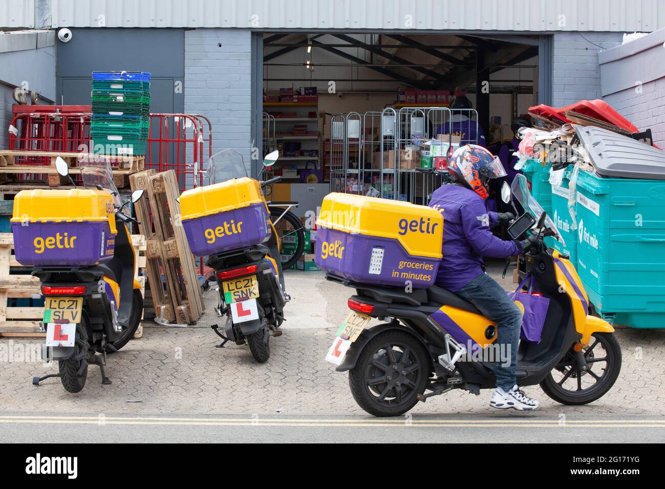 London, UK, 5 June 2021: on a Saturday lunchtime Getir is busy sending out grocery deliveries on electric mopeds from a 'dark shop' on a light industrial estate strategically positioned between Clapham, Balham and Streatham. The Turkish company has recently raised $550 million (£388m) to expand into France, Germany and the USA. Anna Watson/Alamy Live News Stock Photo