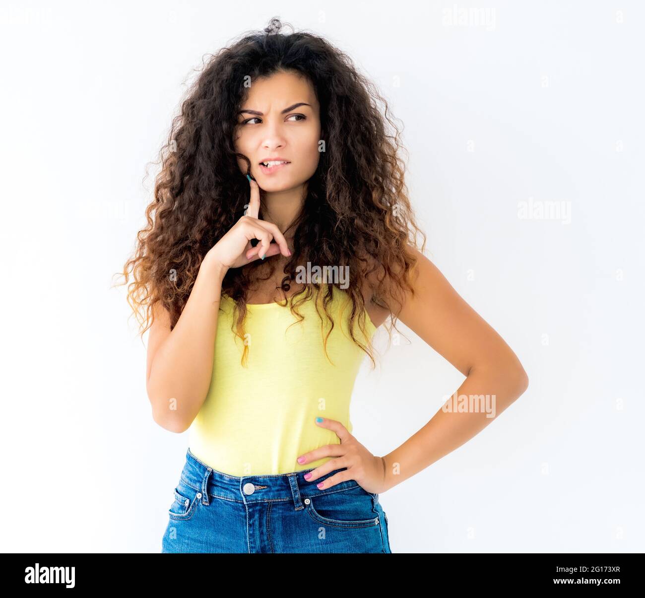 Free Photo  Relaxed smiling afro woman with fancy makeup and accessories  posing with closed eyes and crossed hands on chest, over blue wall