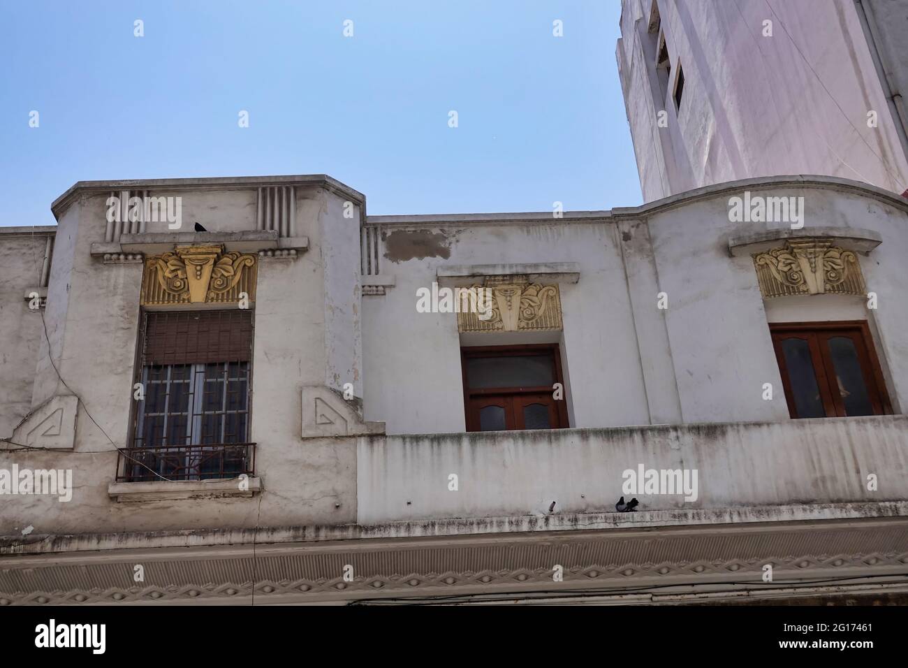 Low angle shot of the facade of an old building with a nice vintage ...