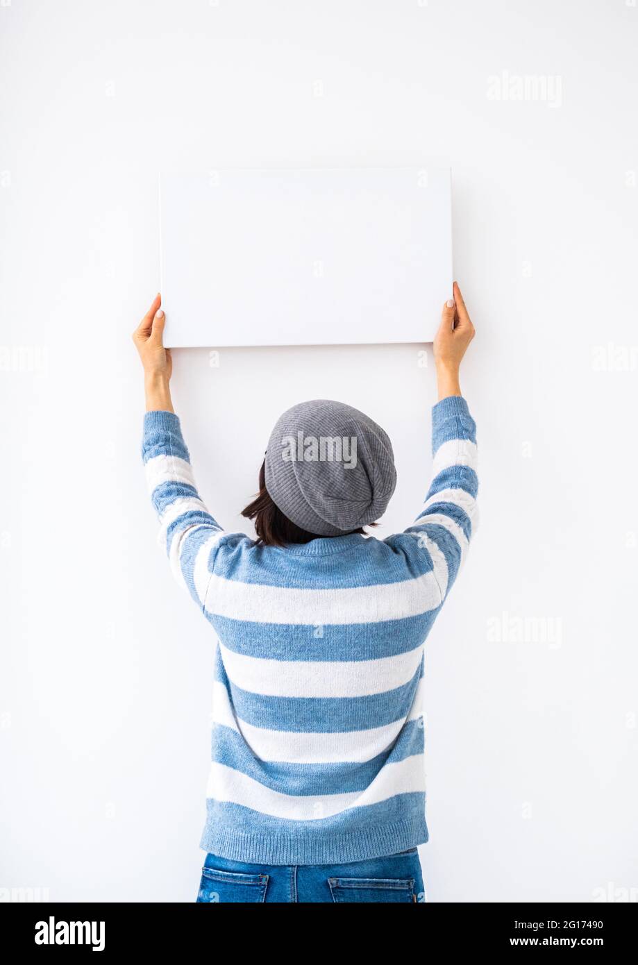 Girl holding blank canvas Stock Photo