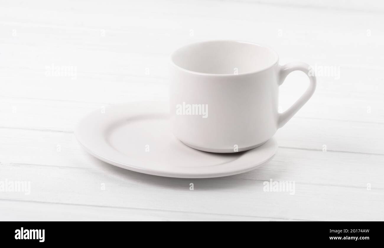 Cup standing on plate Stock Photo