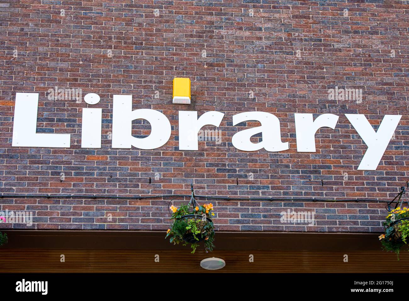 Close up of Library sign on outside wall UK Stock Photo