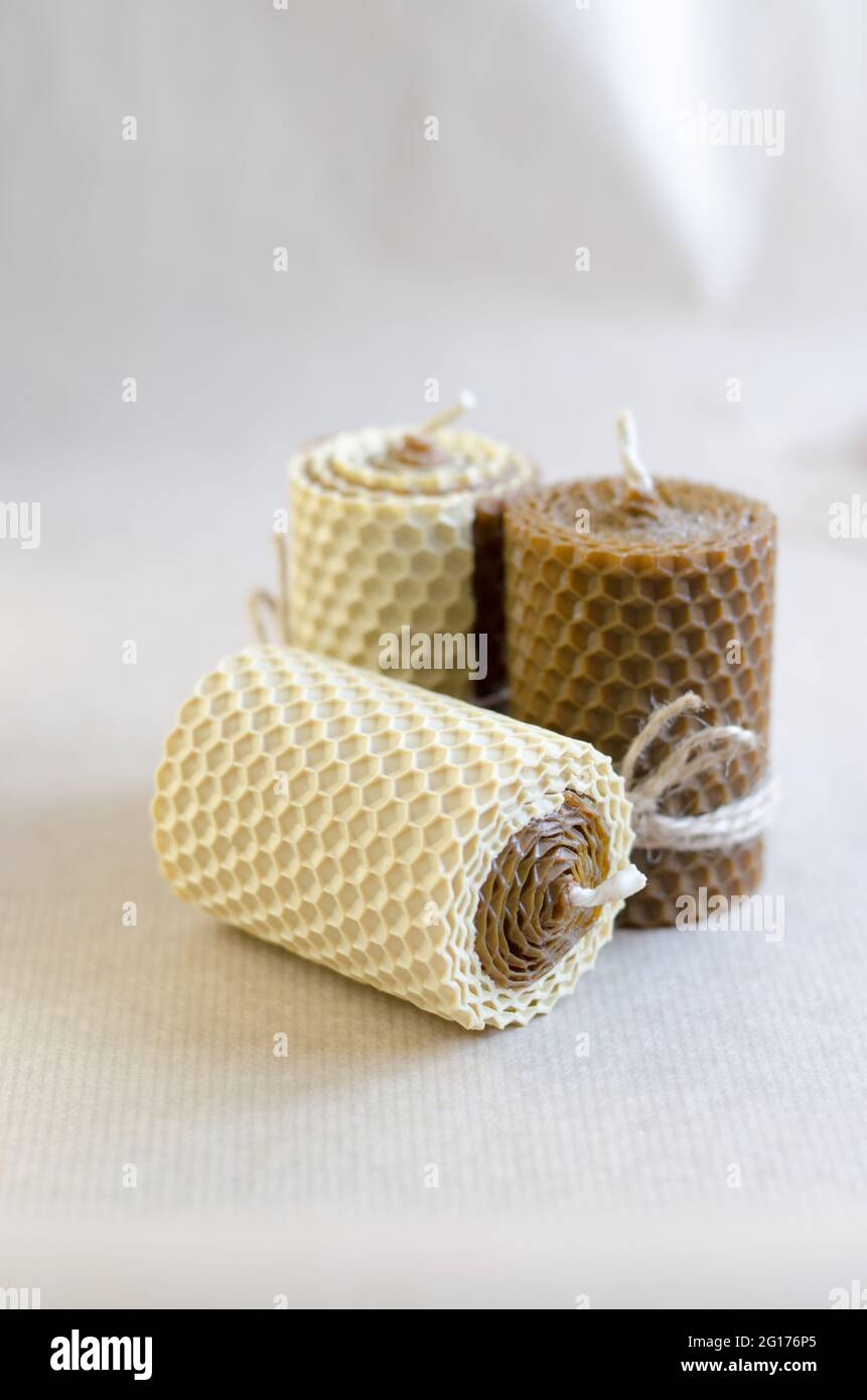 Handmade decorative wax candles with honey aroma. Decorations for the interior. Stock Photo