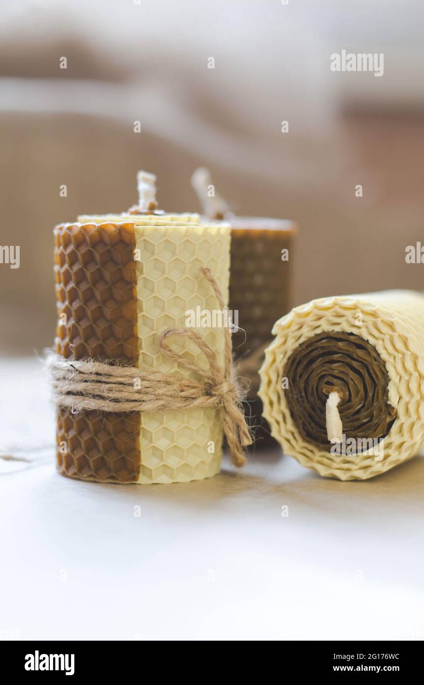 Handmade decorative wax candles with honey aroma. Decorations for the interior. Stock Photo