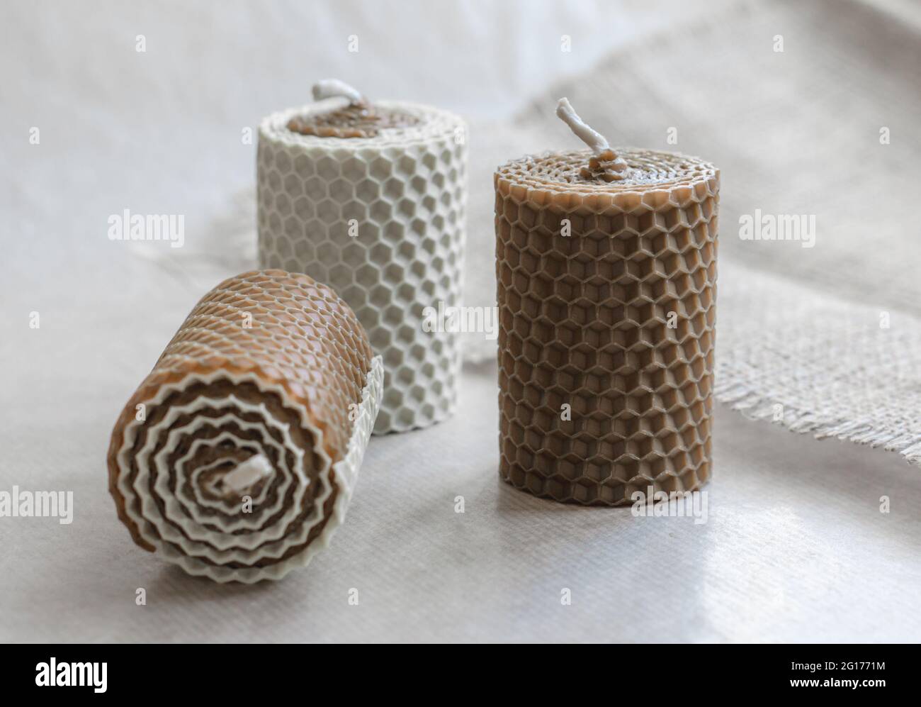 Handmade decorative wax candles with honey aroma. Decorations for the