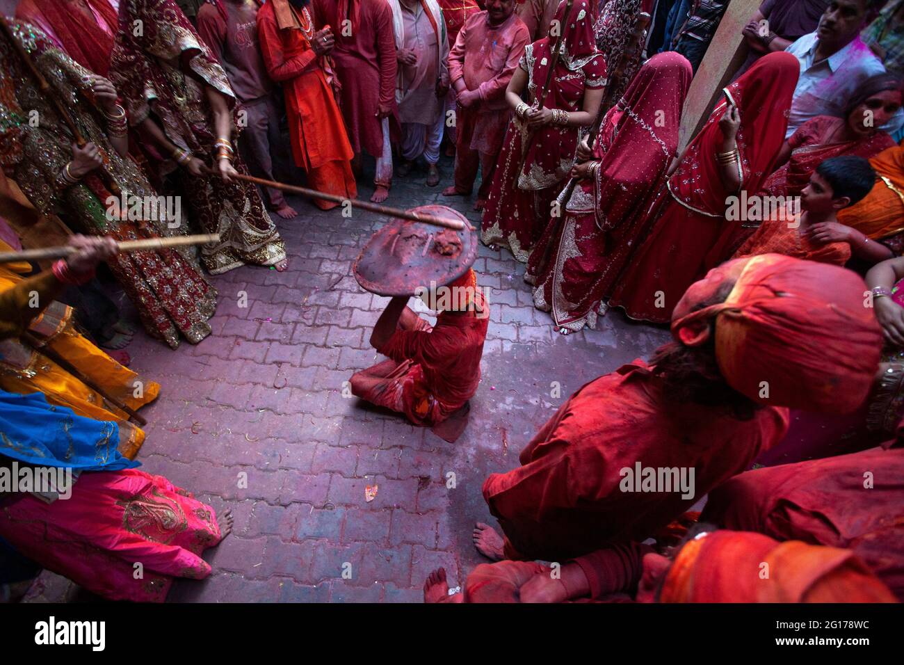 Lathmar Holi festival where Woman of Barsana Village stiking the defending males of Nandgaon village Stock Photo