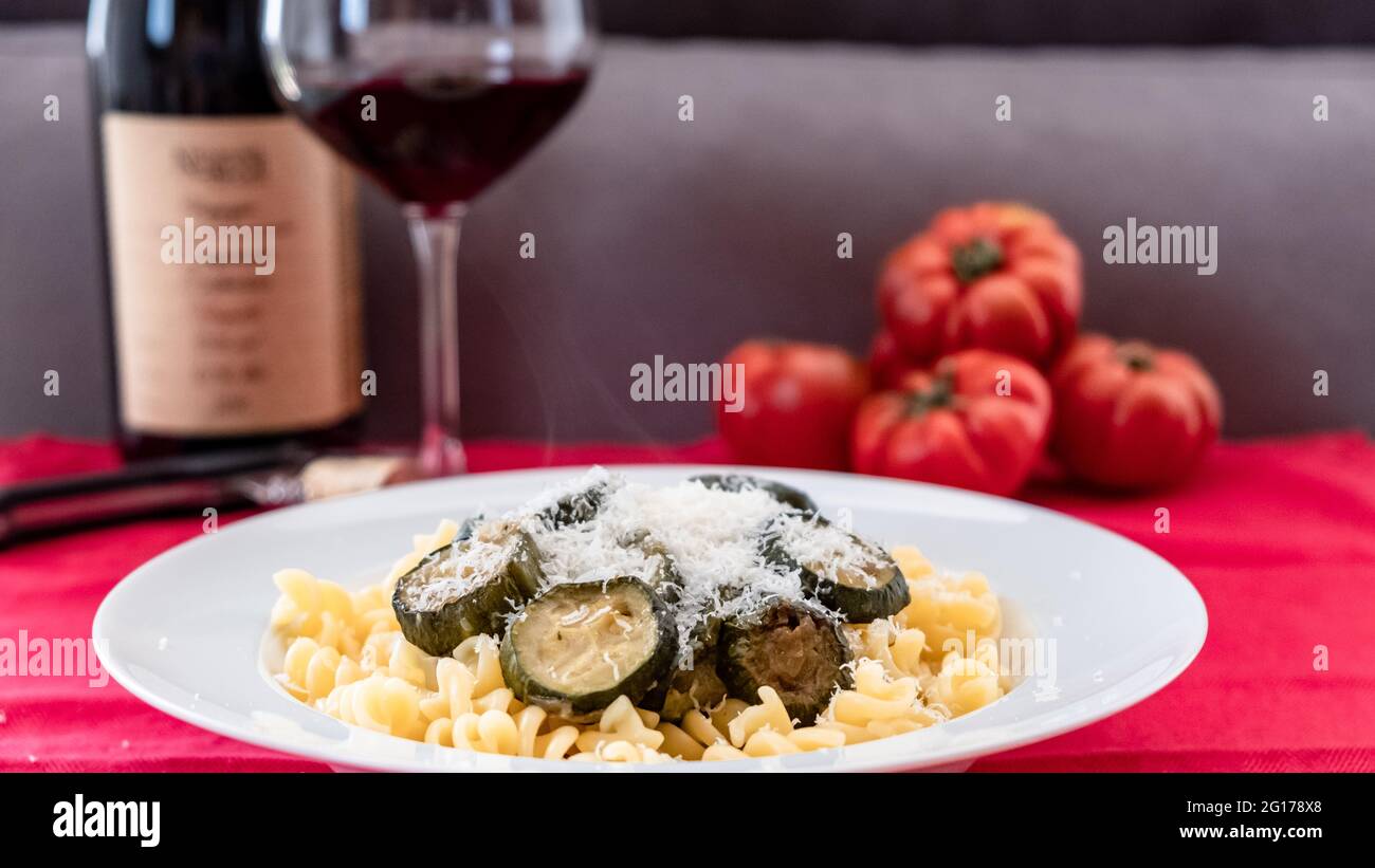 Pasta with zucchini on an italian table Stock Photo