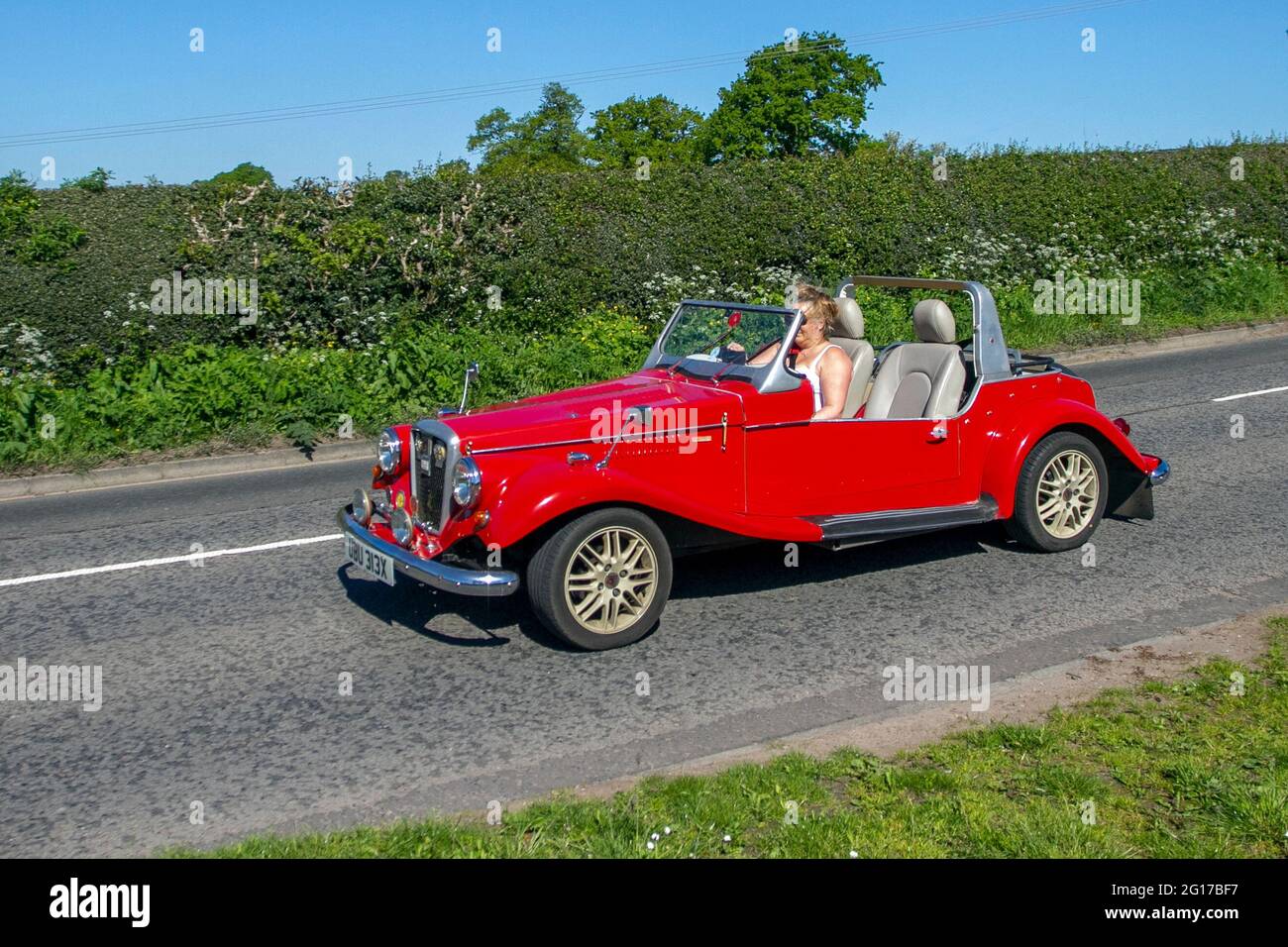 Woman driving 1981 80s Spartan 2&2, kit cars, aluminium panelled body