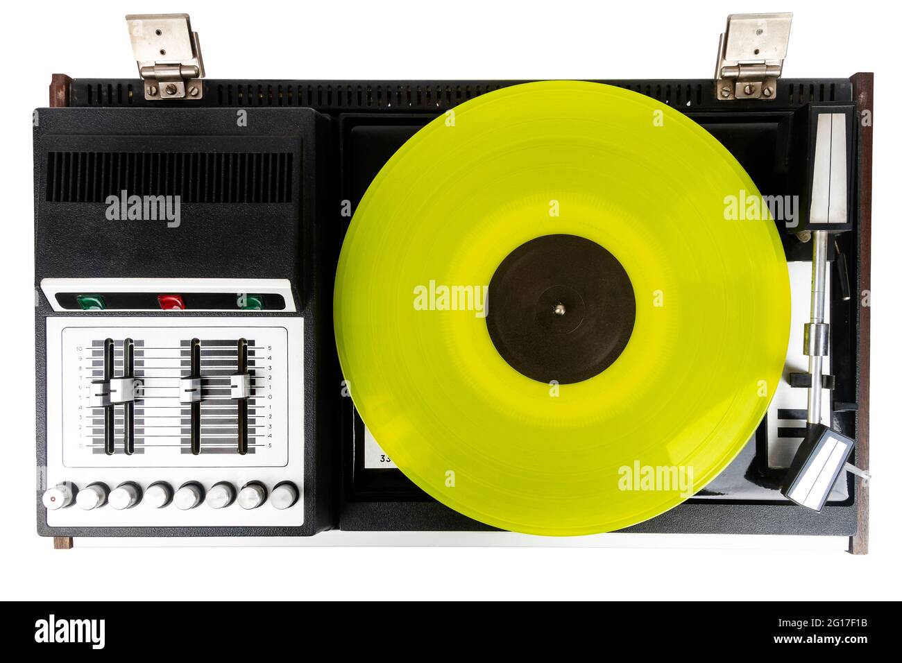 Vintage turntable vinyl record player with yellow vinyl isolated on white background. Stock Photo