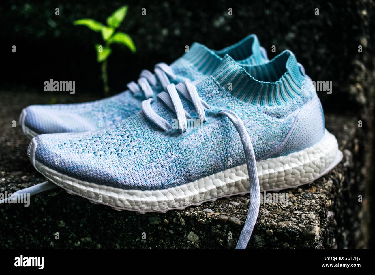 adidas Ultraboost Parley are environmentally friendly running shoes with the same silhouette and midsole as regular Ultraboost shoes. Stock Photo