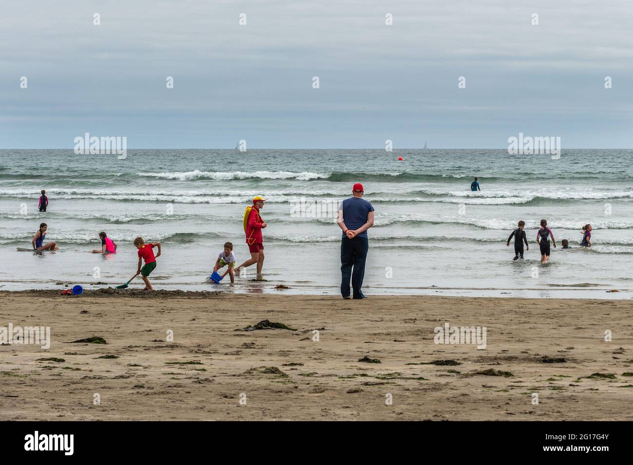 Inchydoney Beach, West Cork, Ireland. 5th June, 2021. Inchydoney Beach was very busy with people today on what was a warm, but overcast day. The best of the weather for the Bank Holiday weekend will be tomorrow with temperatures expected to reach 20 C. Credit: AG News/Alamy Live News Stock Photo