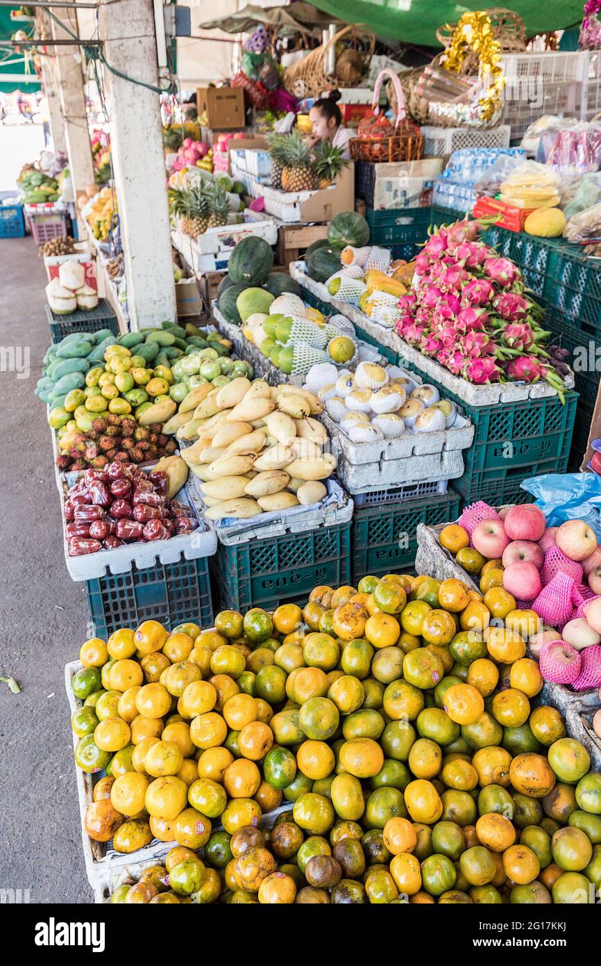 Oranges and fruit on sale at market shop, Pakse, Laos Stock Photo