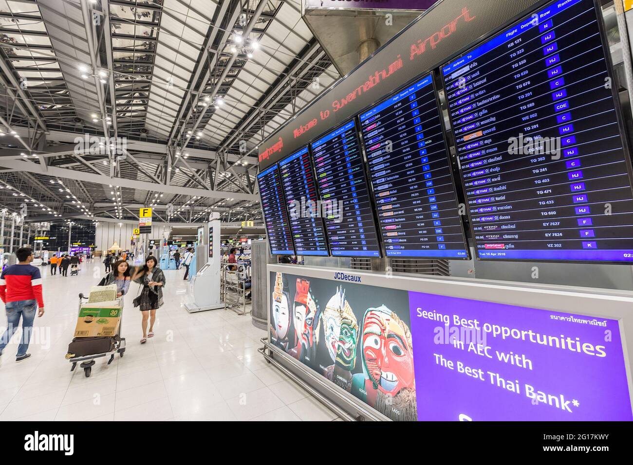 Departure and arrivals board for international travel at Suvarnabhumi Airport, Bangkok, Thailand Stock Photo