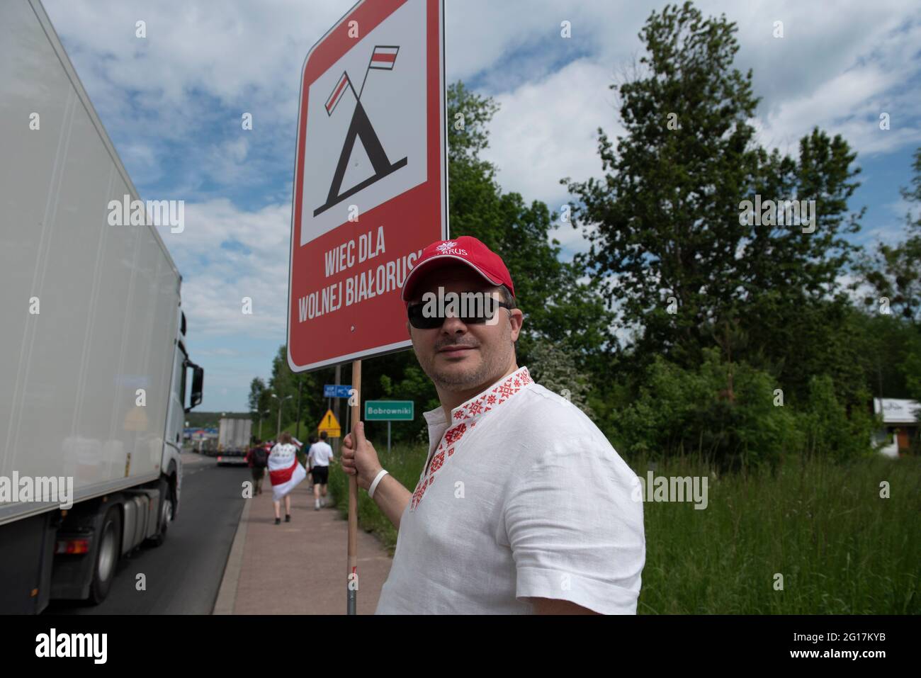 Warsaw, Warsaw, Poland. 5th June, 2021. A man stands near the Polish-Belarusian border holding a sign that reads ''Picket for free Belarus'' on June 5, 2021 in Bobrowniki, Poland. Around a hundred of Belarusian citizens on exilein Poland gathered in Bobrowniki, on the Polish-Belarusian border to demand sanction from European Union towards the Belarusian government. Credit: Aleksander Kalka/ZUMA Wire/Alamy Live News Stock Photo