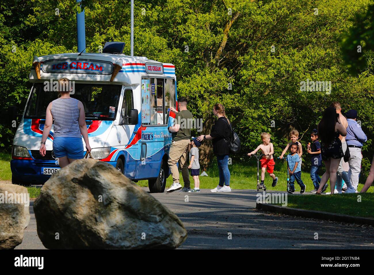 Maidstone, Kent, UK. 05 Jun, 2021. UK Weather: Hot and sunny day in the Mote Park, spanning over 180 hectares, the park is freely accessible to the public and features activities such as children's play areas, dino golf, Sky Trail, climbing wall, watersports centre & leisure centre. Ice cream van serving a queue of customers in the park. Photo Credit: Paul Lawrenson /Alamy Live News Stock Photo