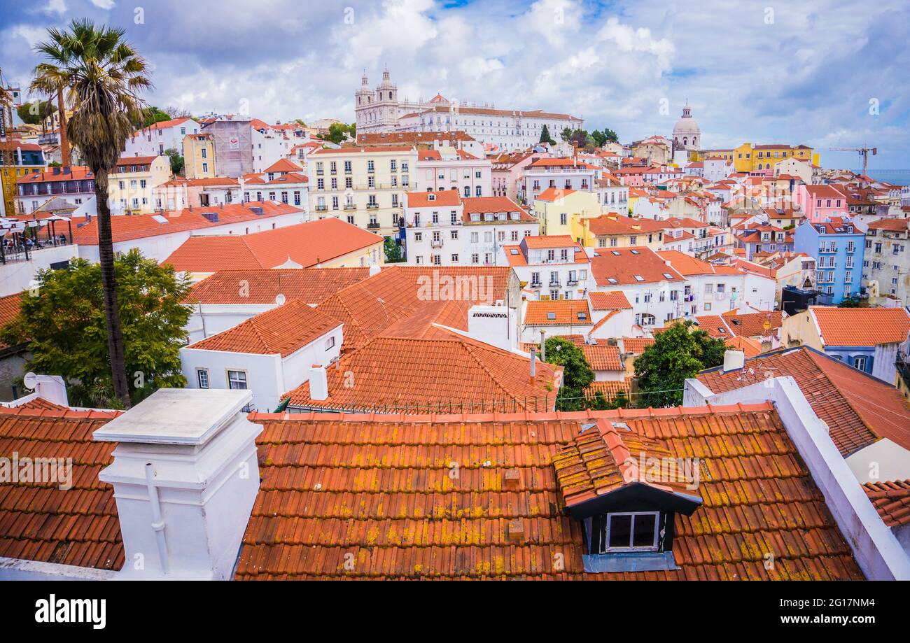 LISBON, PORTUGAL - MARCH 25, 2017: Panoramic view old traditional city of Lisbon with red roofs, Saint Vicente de Fora Monastery view, Alfama district Stock Photo
