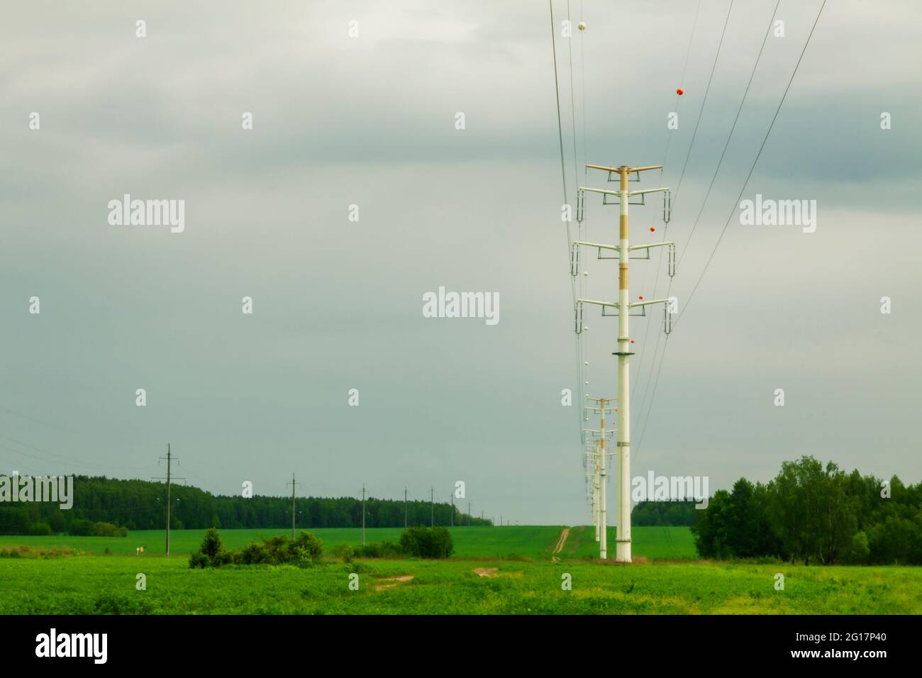 Power line against blue sky and sun power lines hi-res stock ...