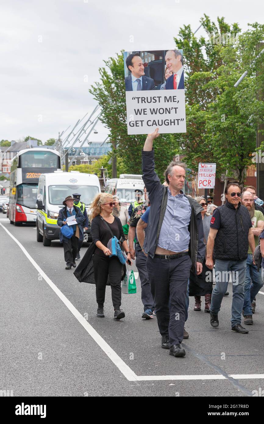 Cork, Ireland. 5th June, 2021. Anti Lockdown Protest, Cork, Ireland. This afternoon people protesting a number of causes relating to the Covid-19 pandemic took to the streets of Cork and marched from Grand Parade to St Patricks Street where they assembled outside of Brown Thomas and gave a number of speeches to a crowd of over 200 people. A large garda presence was at today's demonstration. Credit: Damian Coleman/Alamy Live News Stock Photo