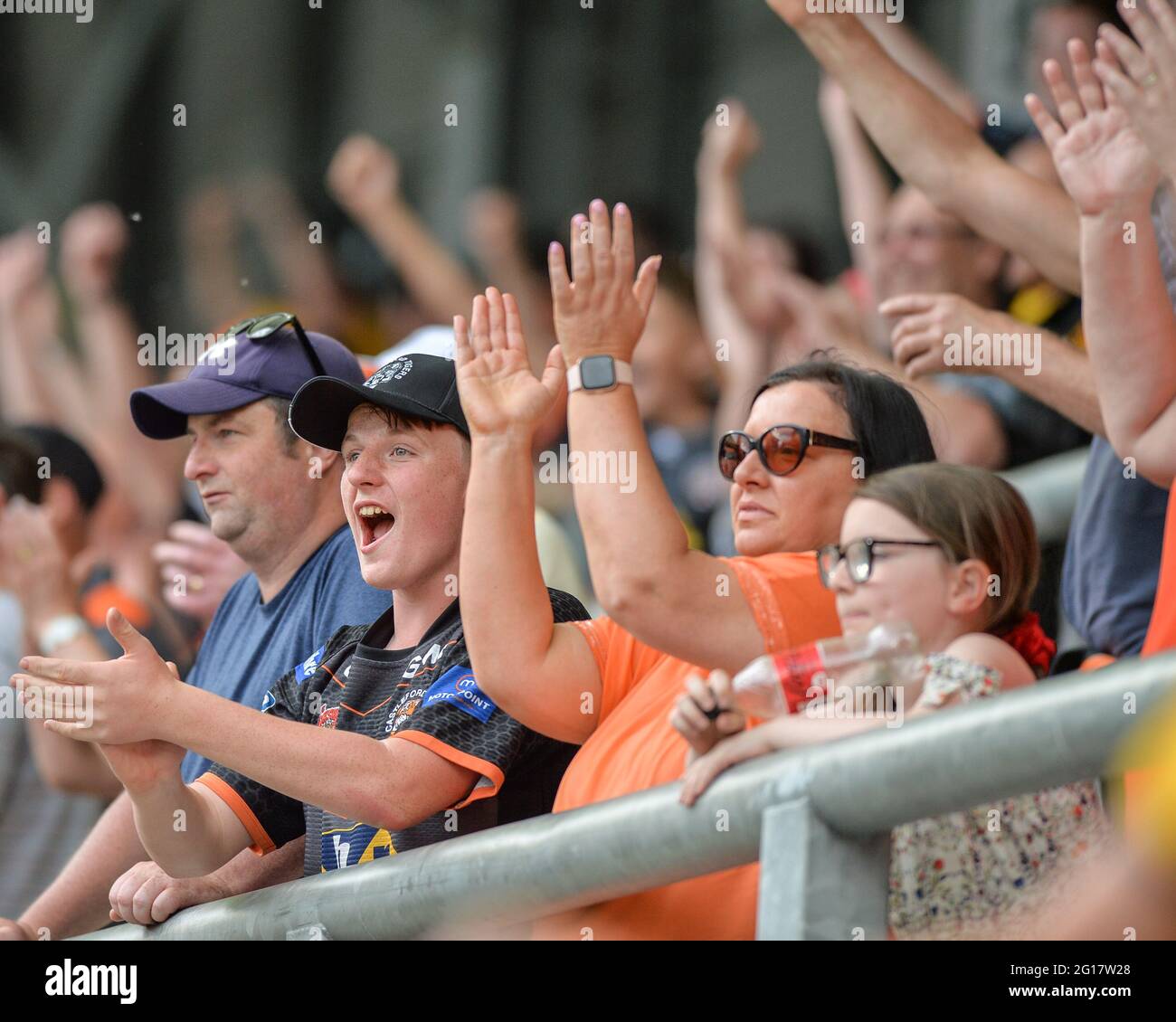 Leigh, England 5 June 2021 Castleford Tigers supporters celebrate try