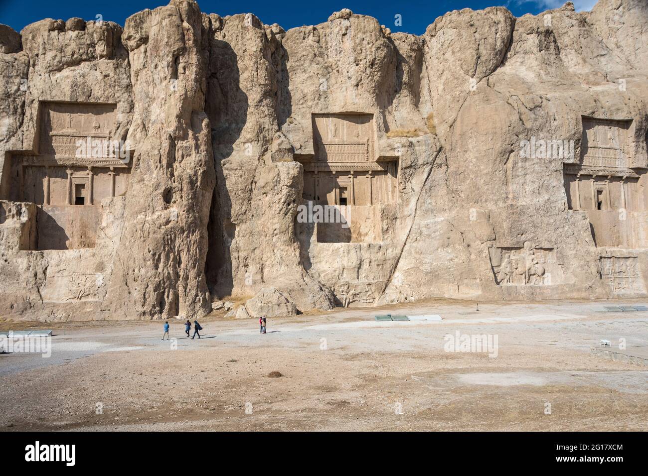 Naqsh-e Rostam,necropolis of the Achaemenid dynasty near Persepolis, with tombs of Darius II,Artaxerxes I,Darius I,cut high into the cliff face. Iran. Stock Photo