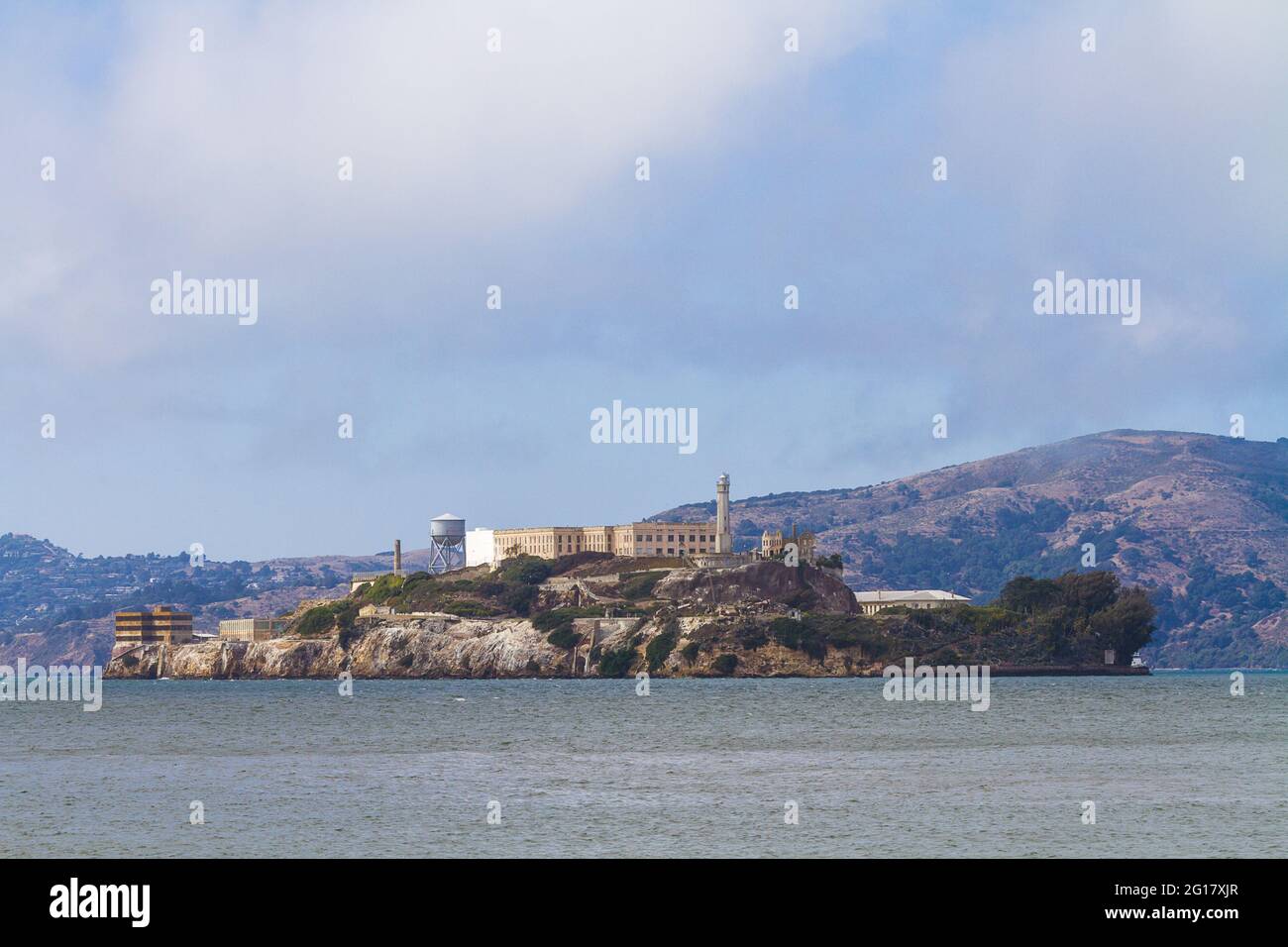 Close up image of the Alcatraz Cell house and lighthouse seen from Pier 39 Stock Photo