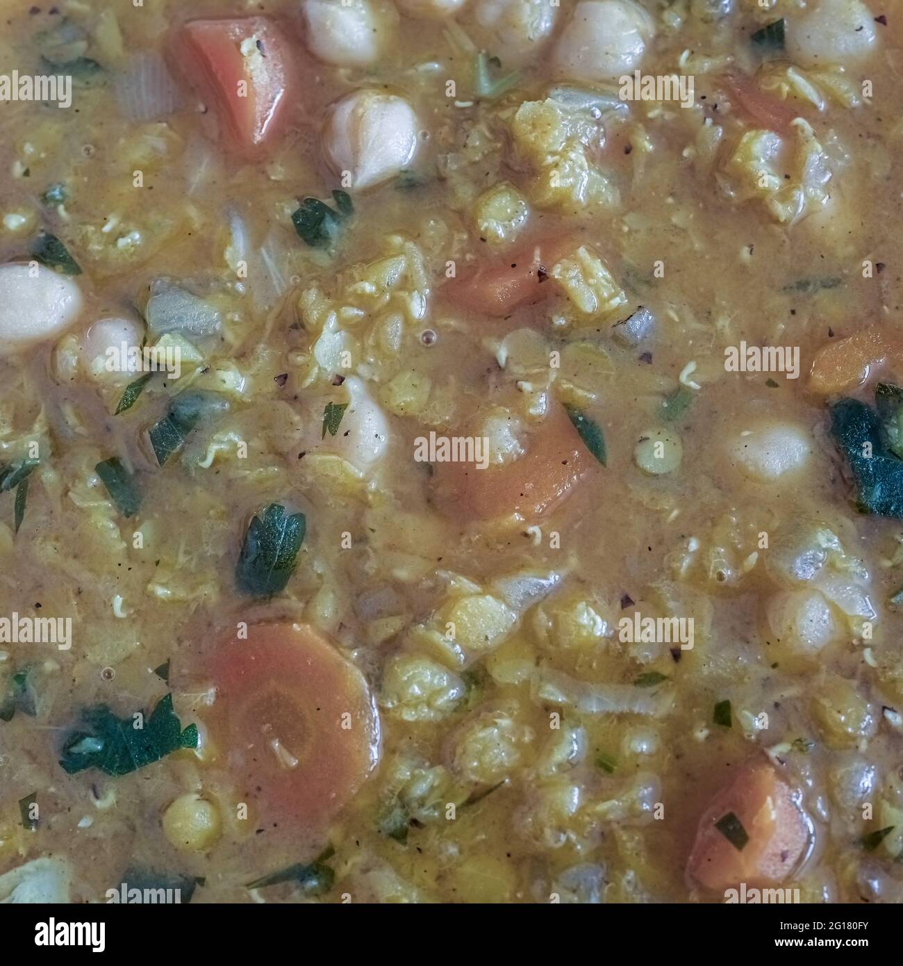 Close-up of homemade vegan soup with red lentils and chickpeas Stock Photo