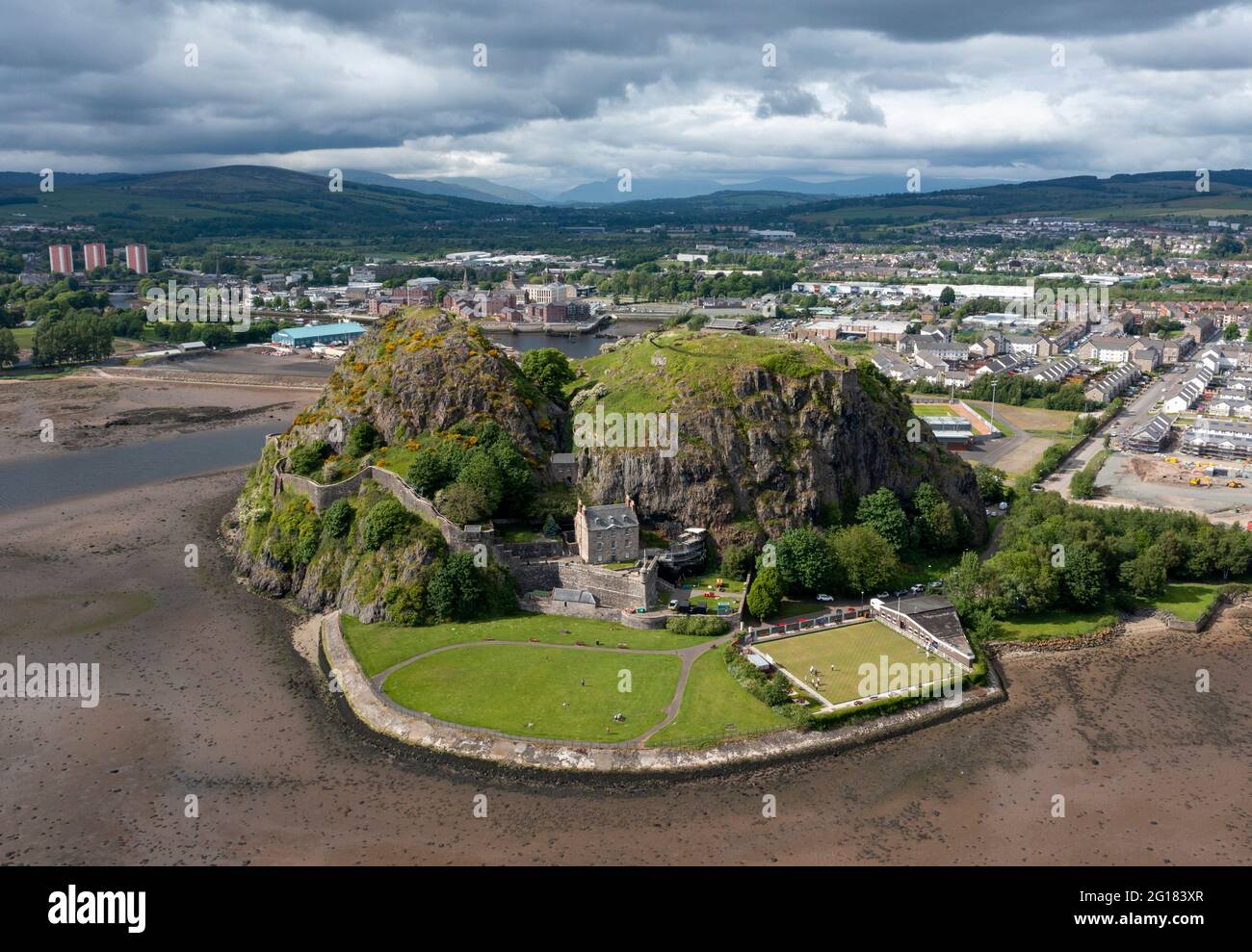 Aerial view of Dumbarton Castle and Dumbarton Rock on the banks of the River Clyde, West Dumbartonshire. Dumbarton Rock Bowling club is bottom right. Stock Photo