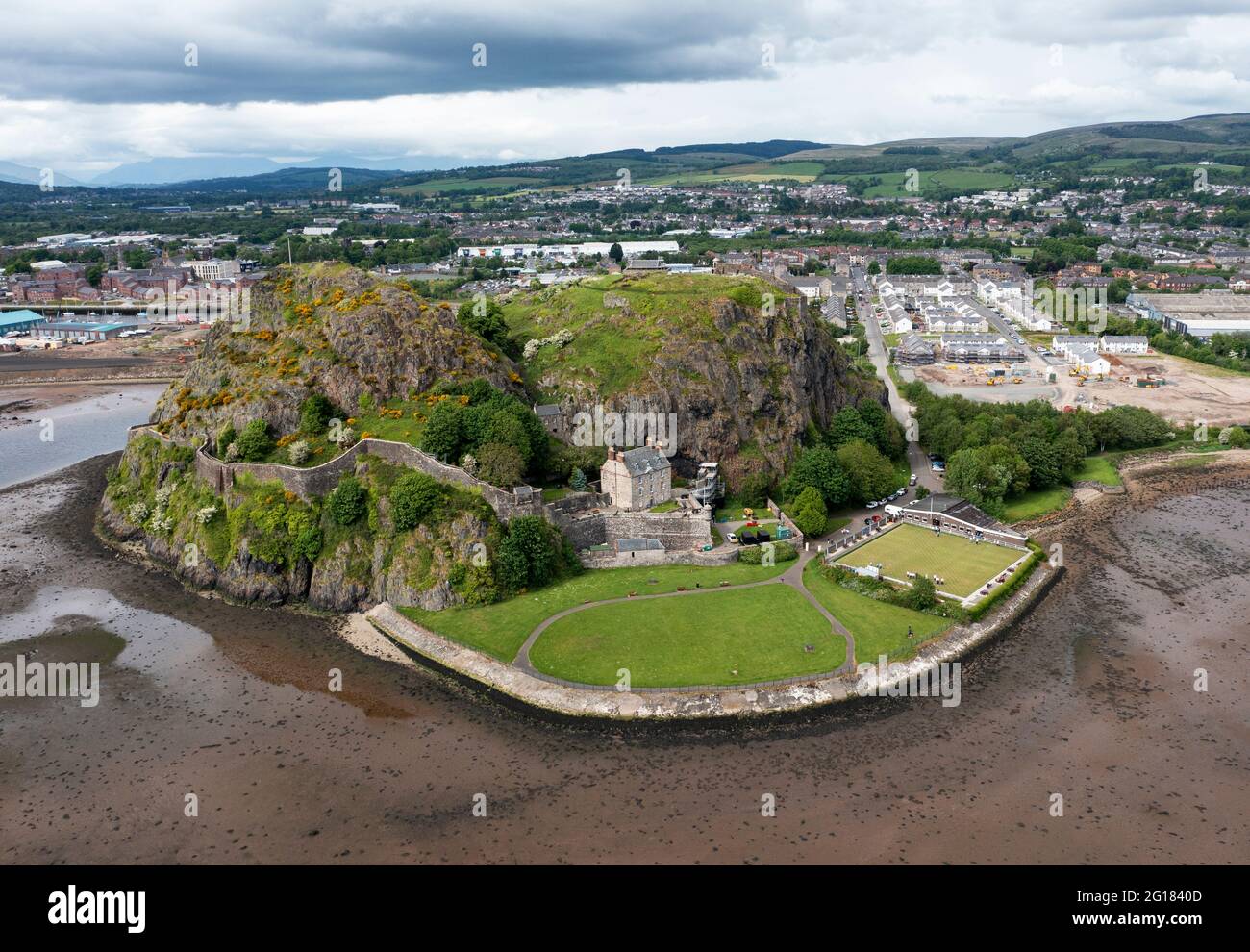 Aerial view of Dumbarton Castle and Dumbarton Rock on the banks of the River Clyde, West Dumbartonshire. Dumbarton Rock Bowling club is bottom right. Stock Photo