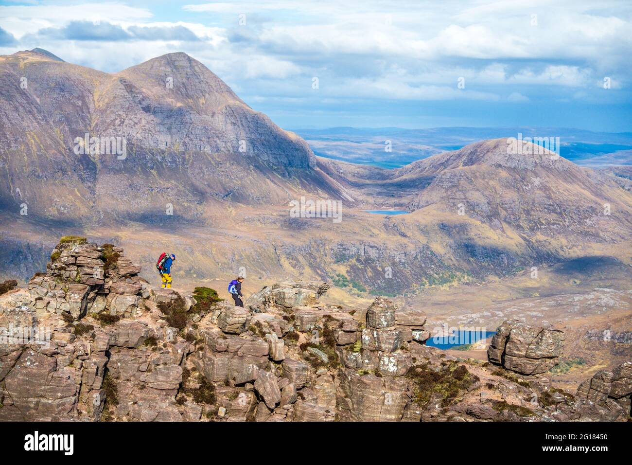 Walkers on  Stac Pollaidh / Stac Polly - a mountain in Assynt in the North West Highlands of Scotland, UK Stock Photo