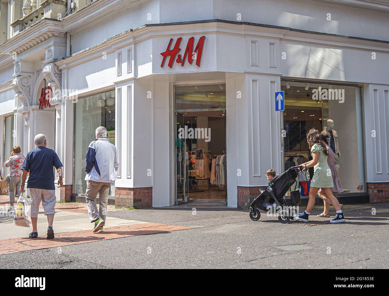 Shoppers walk past H&M Fashion Store on Royal Avenue in Belfast Stock Photo  - Alamy