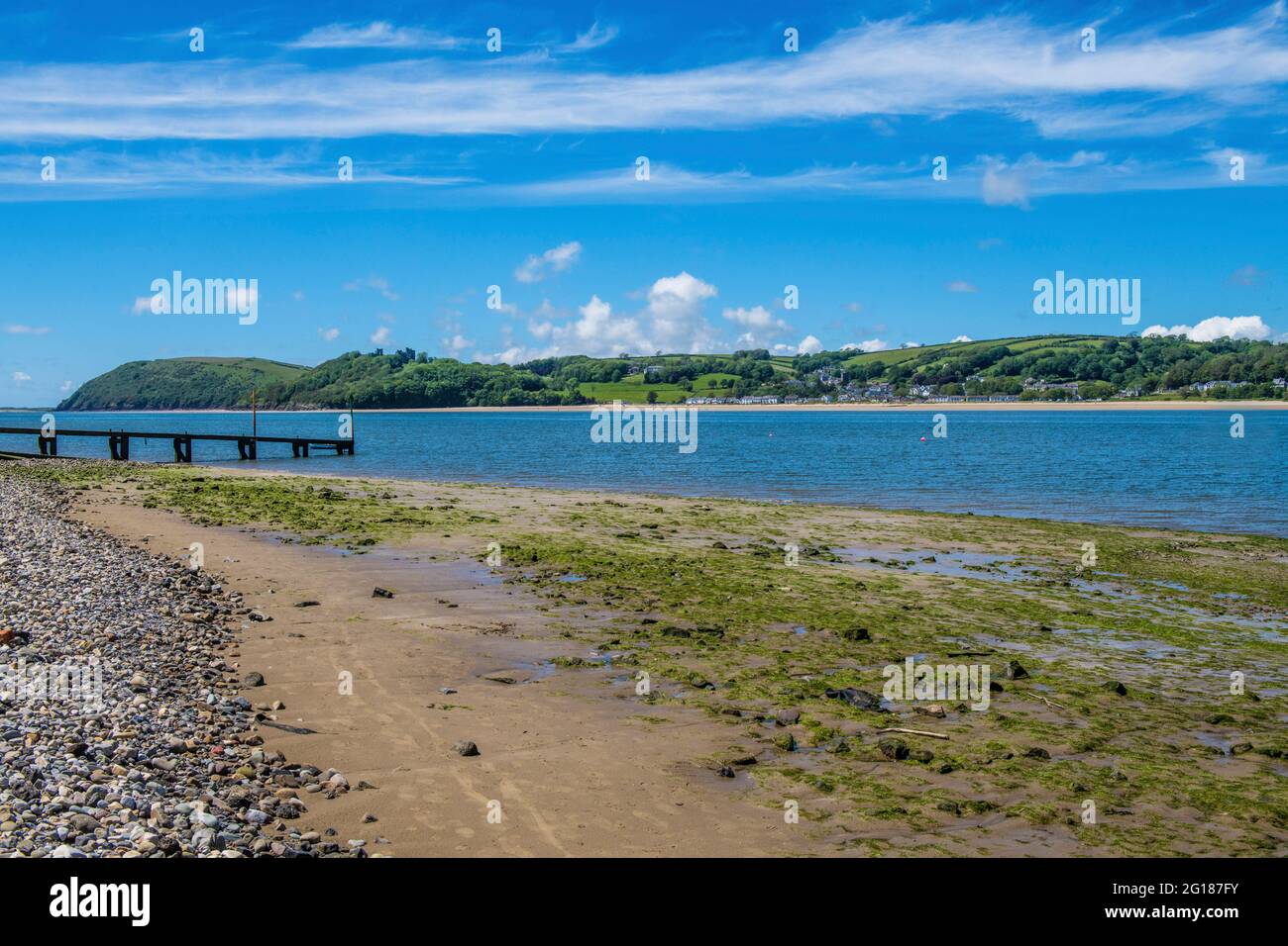 The view from Ferryside across the River (Afon) Tywi estuary in Carmarthenshire on the coast on a sunny June day in south Wales Stock Photo