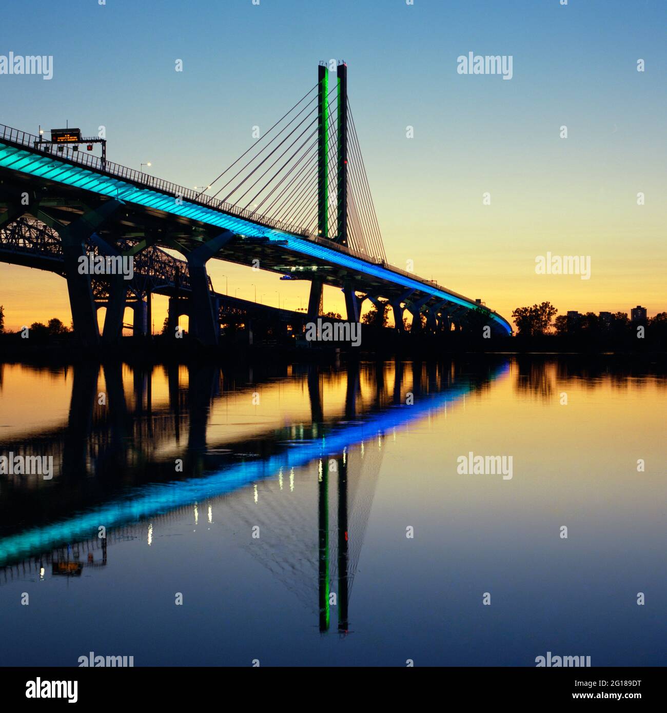 Illuminated Samuel-de Champlain bridge at sunset, Brossard, Quebec, Canada, 2020 Stock Photo